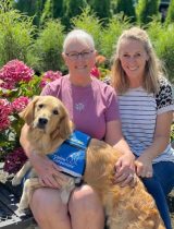 Lilikoi, a golden retriever, with Nancy Rice and Kim Blatz