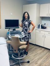 Clinic manager Leah Bosman stands in front of a new echocardiography space