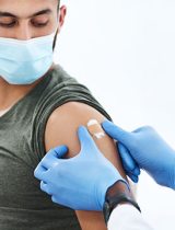 Young man getting a flu shot