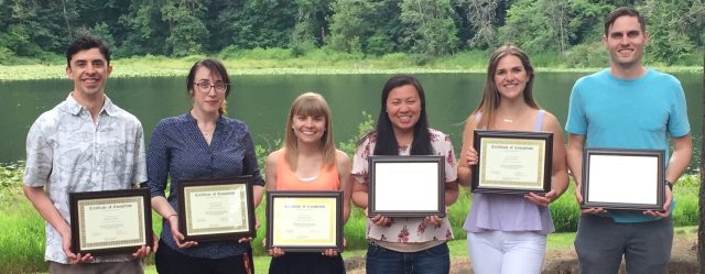 Recent PGY1 Pharmacy Residency graduates display their completion certificates