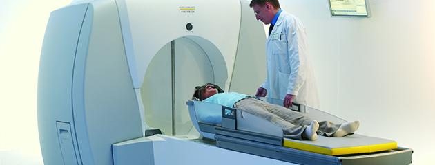 A physician guides a patient through the gamma knife process