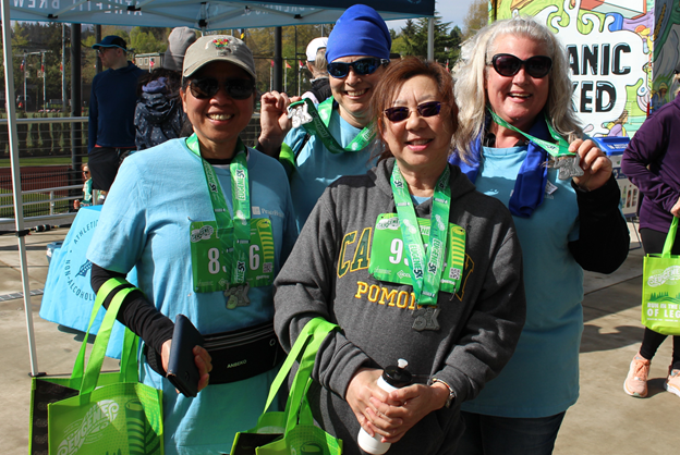 PeaceHealth Employees pose for a picture during a marathon in Eugene