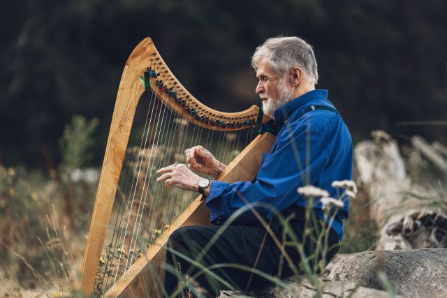Duncan plays the therapeutic harp in nature in Bellingham, Washington