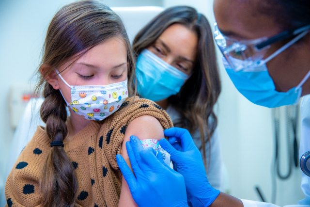 girl receives seasonal flu vaccine