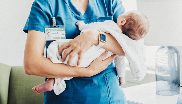 Nurse holding baby