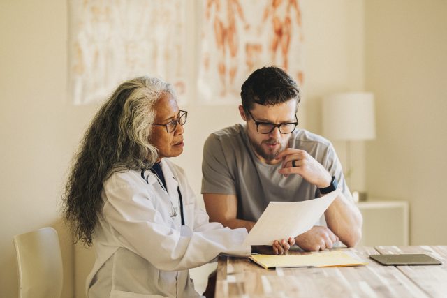 Doctor and patient review treatment plan