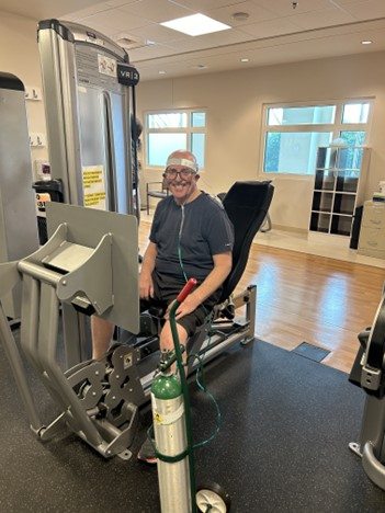 Bret using an exercise machine at peacehealth sacred heart at riverbend