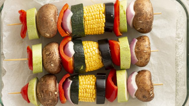 a few skewers of veggies prepped for grill