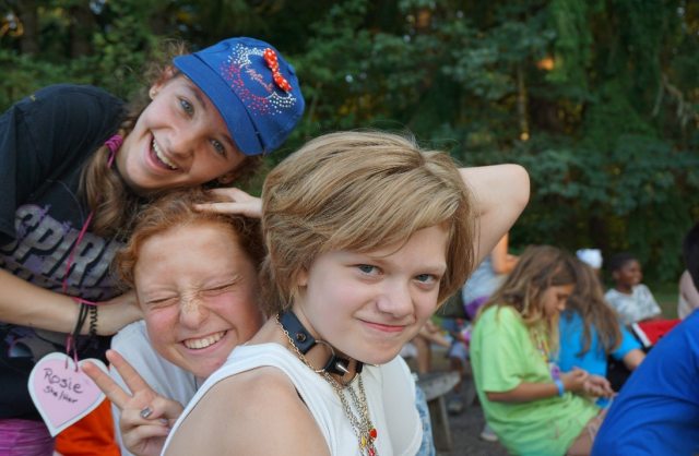 3 courageous kids smiling at the camera