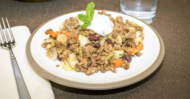 cabbage and bulgur hash recipe on white plate