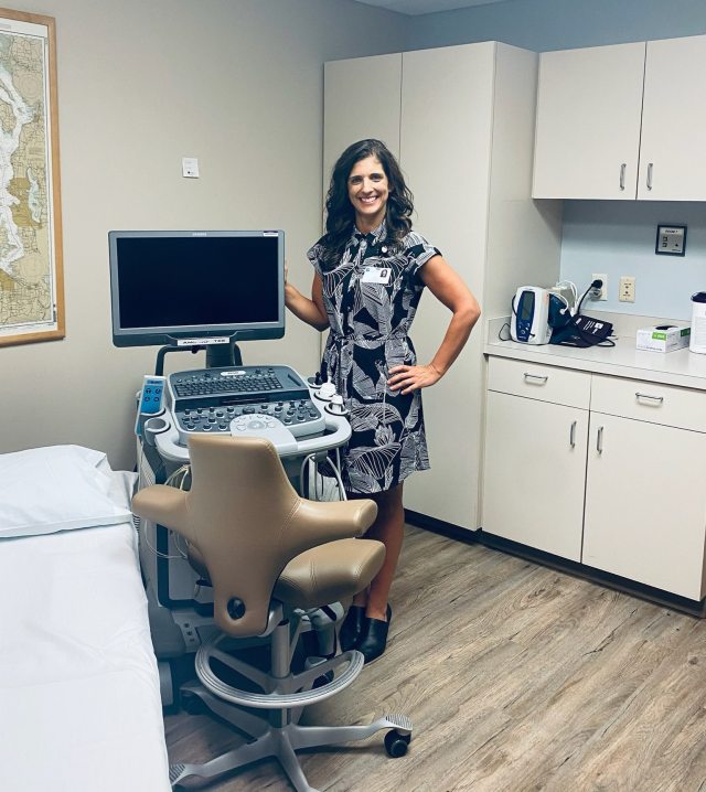 Clinic manager Leah Bosman stands in front of a new echocardiography space