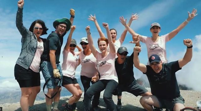 Lisa Boswell and her hiking crew celebrate on top of Mount St. Helen