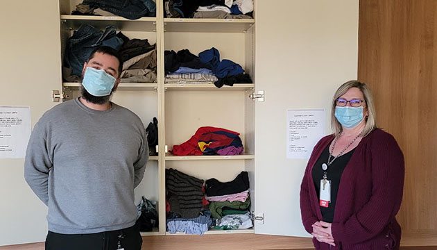 Dr. Joseph Simon and Chrystal Work next to the dignity closet