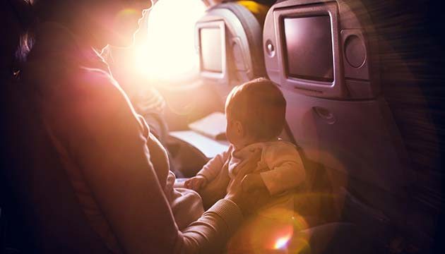 Mom with young baby on an airplane