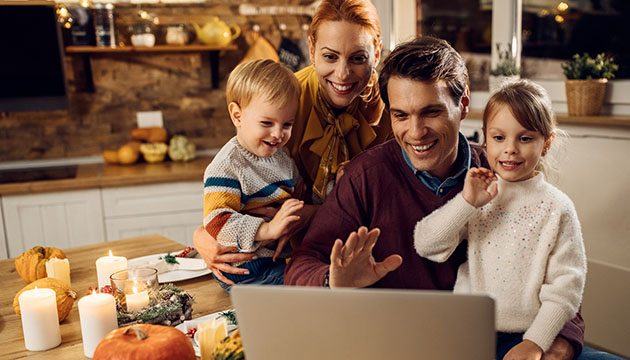 During holidays, family waves to loved ones in a virtual gathering