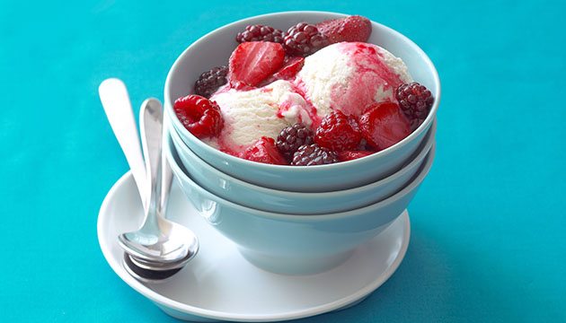 bowl of berries over ice milk