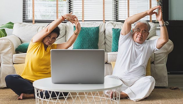 Woman and man exercise at home