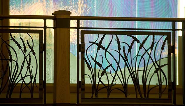 stained glass and wrought-iron cattail railing by chapel in PeaceHealth Sacred Heart Medical Center at RiverBend