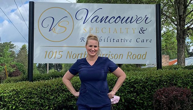 Stacie Jesser in front of Vancouver Specialty and Rehabilitative Care