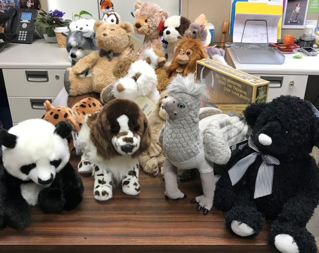 Donated stuffed animals sit on a table at a Vancouver PeaceHealth Pharmacy location