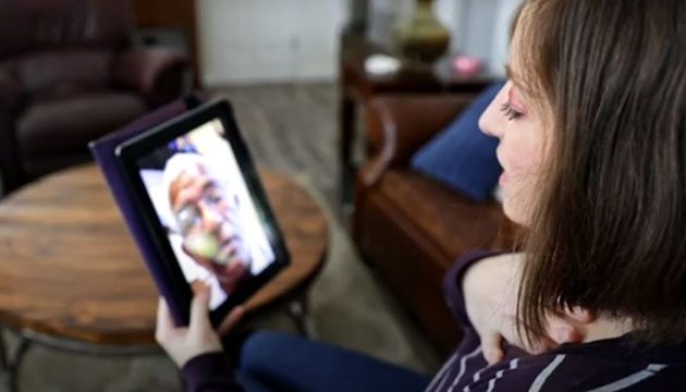 Woman talks with a doctor using her tablet