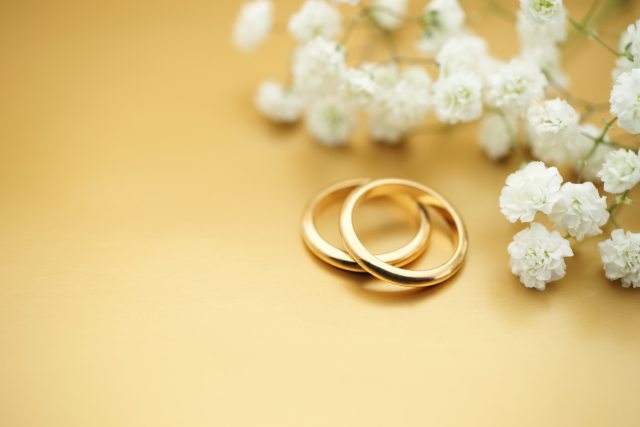 close-up of two gold wedding rings